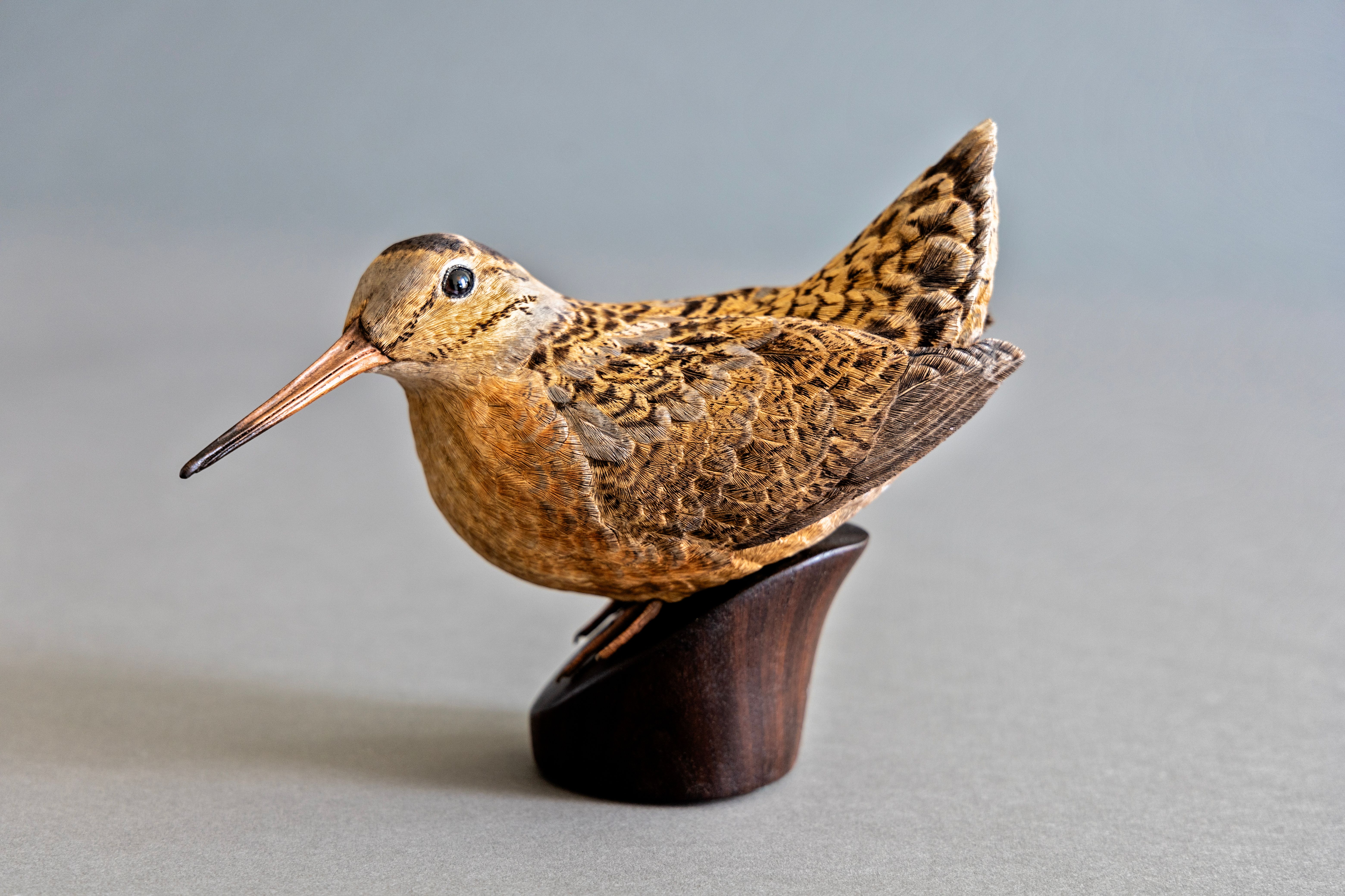 American Woodcock sculpture on dark wooden base